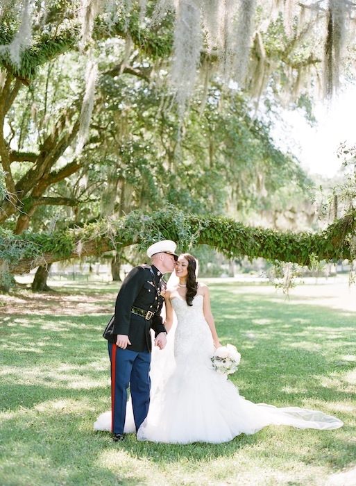 Gown by Mark Zunino. Florals by Charleston Stems. Image by KT Merry Photography at Middleton Place.
