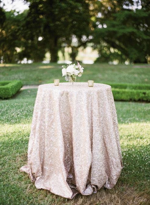 PRETTY IN PINK: Cocktail tables in Middleton’s Octagonal Garden shimmered in  sequin-covered rose-gold La Tavola linens.