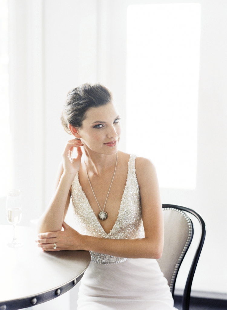 Jim Hjelm’s gown with sequin bodice and netting from Gown Boutique of Charleston. David Yurman’s sterling silver and diamond pendant necklace from REEDS Jewelers. Yellow gold diamond ring from Joint Venture Estate Jewelers. Image by Corbin Gurkin, photographed at The Vendue.