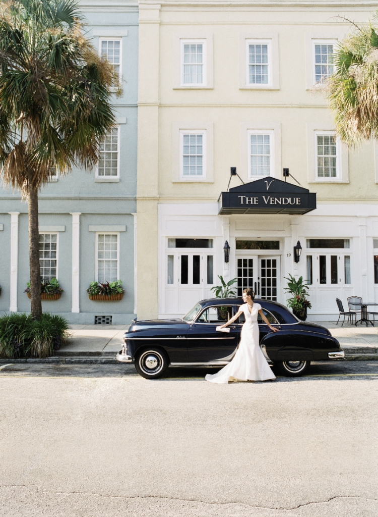 Justin Alexander’s silk dupioni cap-sleeved gown with pearl and crystal waistband from Bridal House of Charleston. 1950 Chevrolet Bel Air Deluxe car from Lowcountry Valet &amp; Shuttle Co. Image by Corbin Gurkin, photographed at The Vendue.