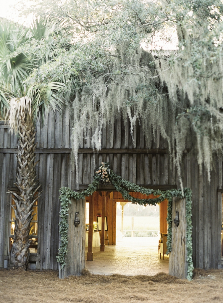 HANGING OUT: Heather Barrie of Gathering Floral + Event Design draped the entrance to the Cotton Dock at Boone Hall Plantation with garlands of seeded eucalyptus.
