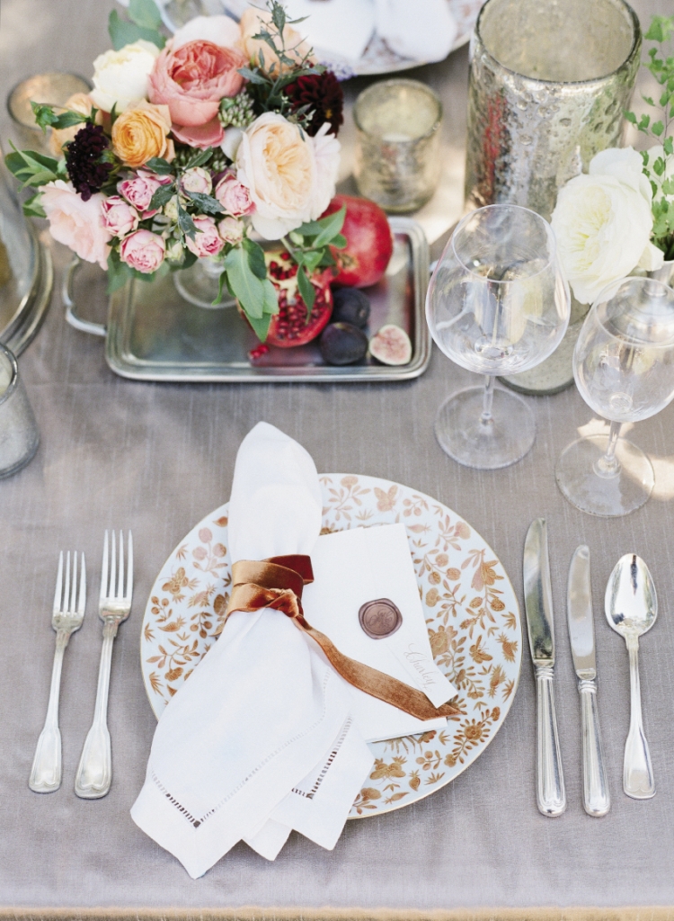 The Sacred Bird and Butterfly pattern was first noted in Charleston in 1808 at the Nathaniel Russell House; Yeamans Hall Club serves on reproductions of the china. Martha gathered luxe velvet ribbon in the same rusty hue to bind napkins.