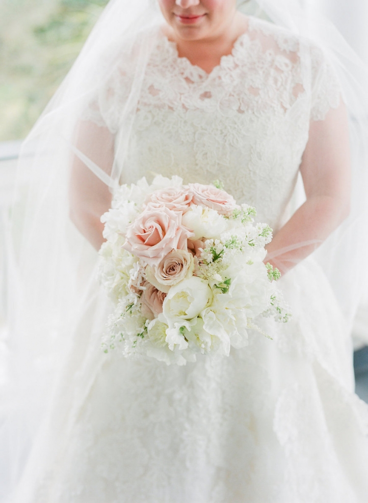 Photograph by Corbin Gurkin. Bride&#039;s attire by Oscar de la Renta. Bouquet by Blossoms Events.