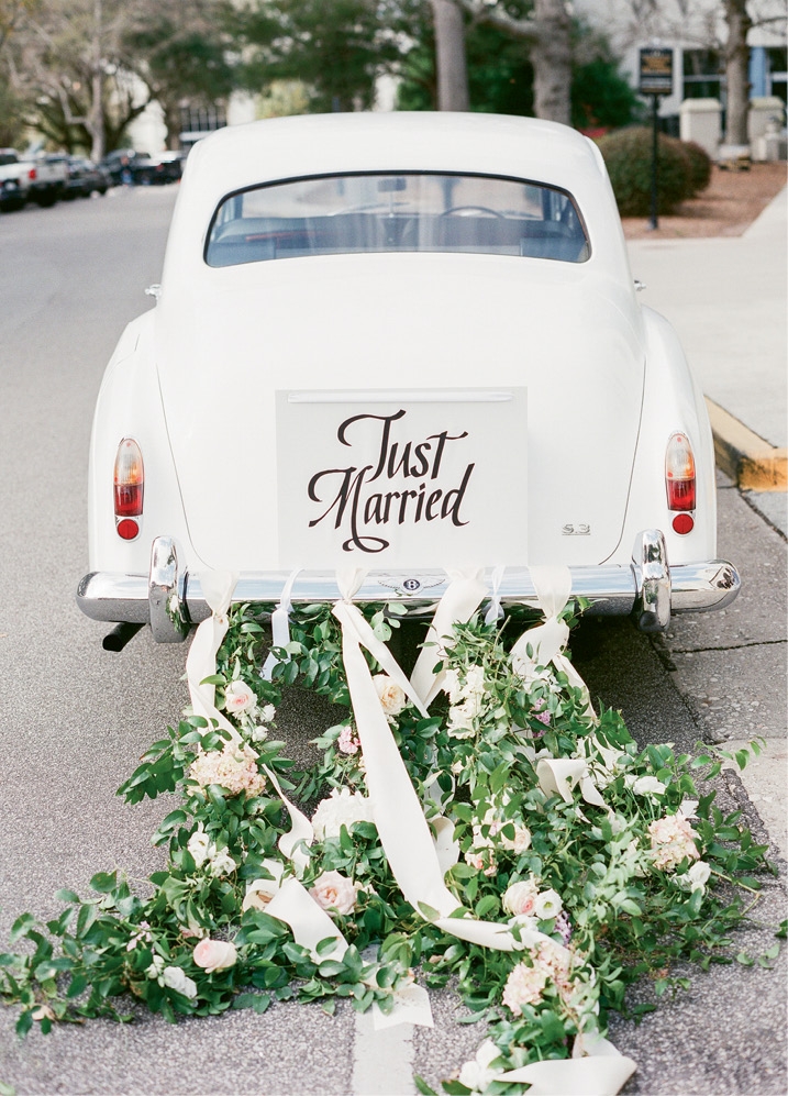 Photograph by Corbin Gurkin. Florals by Blossoms Events. Getaway car by Charleston Style Limo.