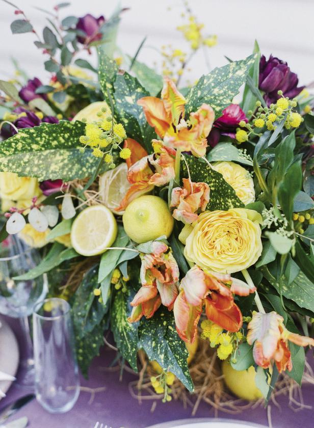 Our favorite floral takeaway from the evening? Incorporating sliced lemons into arrangements. We’ve seen the whole-fruit version but loved how glistening halves freshened things up. Cut lemons across at middle, then spear with a floral pick and plant in moistened florist foam. Florals by Mindy Rice Floral &amp; Event Design. Photograph by Corbin Gurkin.