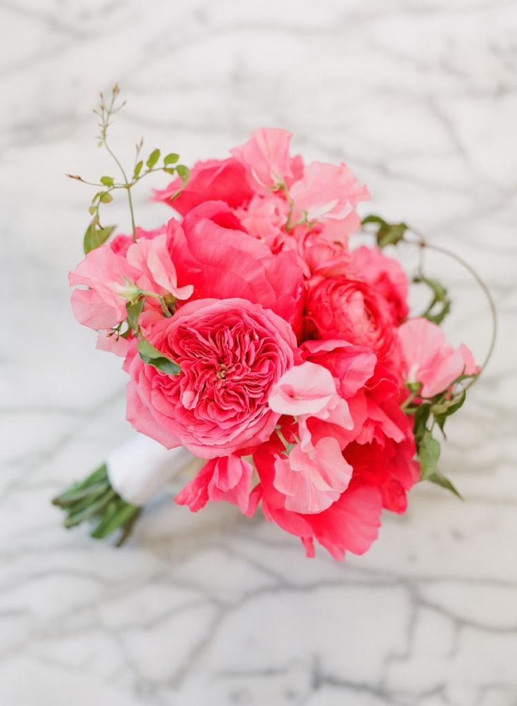 “We wanted the flowers to look like they could have been freshly gathered from a garden,” says Heather Barrie of Gathering Floral + Event Design of the loose bouquets the wedding party carried.