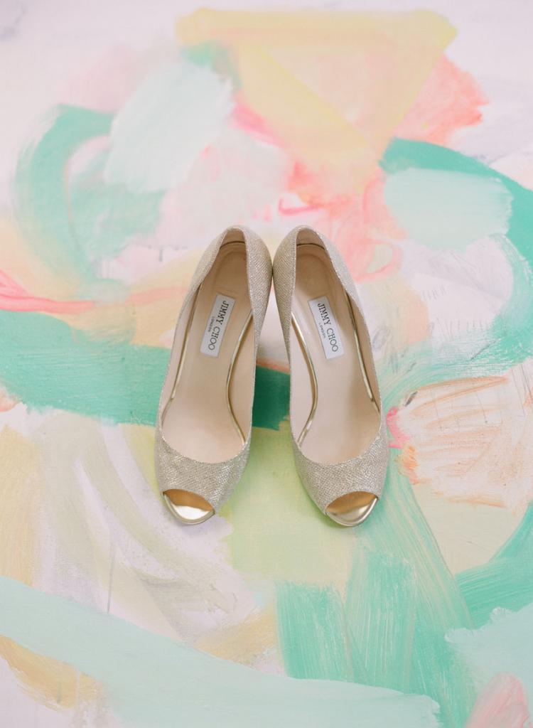 Artist Sally King Benedict (whose work is pictured here with Cate’s Jimmy Choo heels) is a family friend of the Morse’s and one of the bride’s favorite talents. Cate commissioned Sally to craft portraits of each of her attendants and gifted them the abstract pieces.