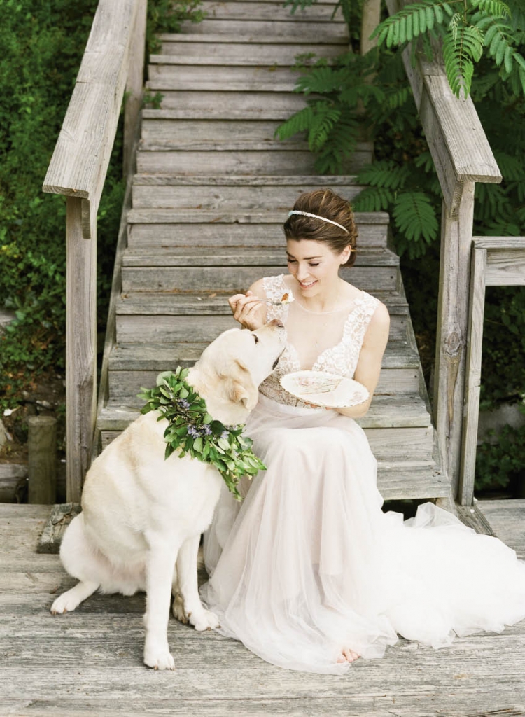 Wtoo’s “Marnie” A-line gown with plunging neckline and illusion panel from Jean’s Bridal. Crystal headband from Out of Hand.  “Droplet” chalcedony and gold necklace from Kate- DavisJewelry.com.  Dog’s floral wreath from Out of the Garden. Confetti cake by Jessica Grossman, Patrick  Properties Hospitality Group. China and silver from Polished.
