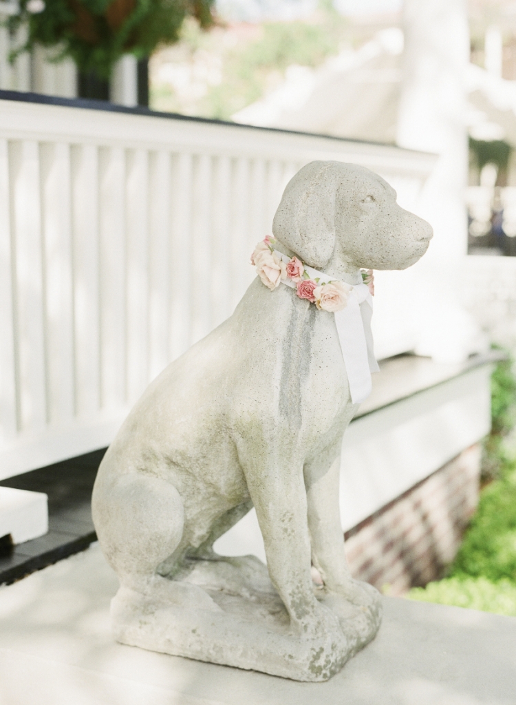 Katie’s mom regularly decorates the “dogs” that flank their home, so floral collars were a must. Florals by Tara Guerard Soiree. Photograph by Corbin Gurkin.