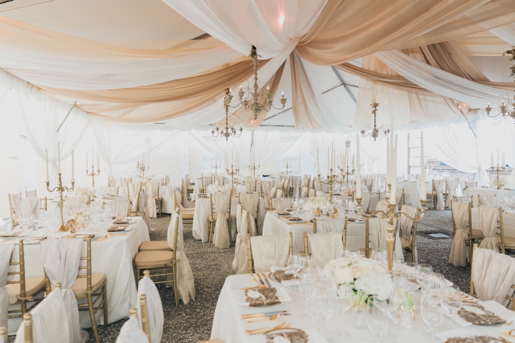 Photograph by Corbin Gurkin. Tent and rentals by Snyder Event Rentals. Design by Tara Guerard Soiree. Lighting by Production Design Associates.