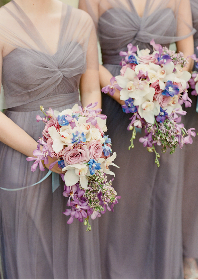 “We’ve seen a shift from tightly packed  handheld florals to loose, more organic arrays,” Tara  explains of the cascading bridesmaid bouquets. (Photo by Corbin Gurkin)
