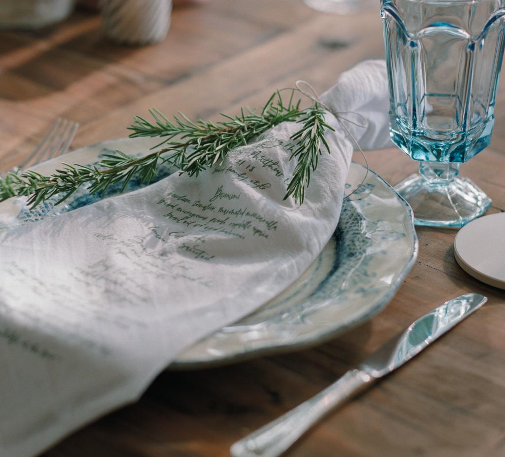 Printing a menu on the table linens? Genius, Lettered Olive!