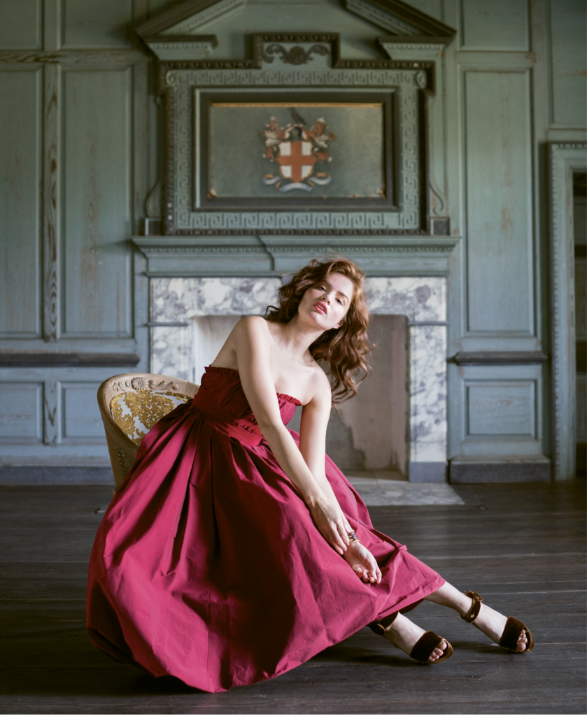 Brock Collection’s “Pearl” belted silk gown from RTW. Gold and ruby ring from Diamonds Direct. Brackish’s “Walker” cuff from Drayton Hall Gift Shop. Velvet bag from Out of Hand. Dee Keller’s “Ramsey” velvet sandals from Shoes on King