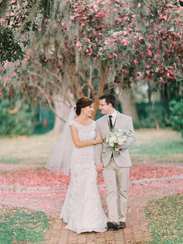 Bridal gown by Allure Bridals, available in Charleston through Bridals by Jodi. Groom’s suit from Express. Groom’s vest from J.Crew. Bouquet by Branch Design Studio. Image by Amy Arrington Photography at Old Wide Awake Plantation.