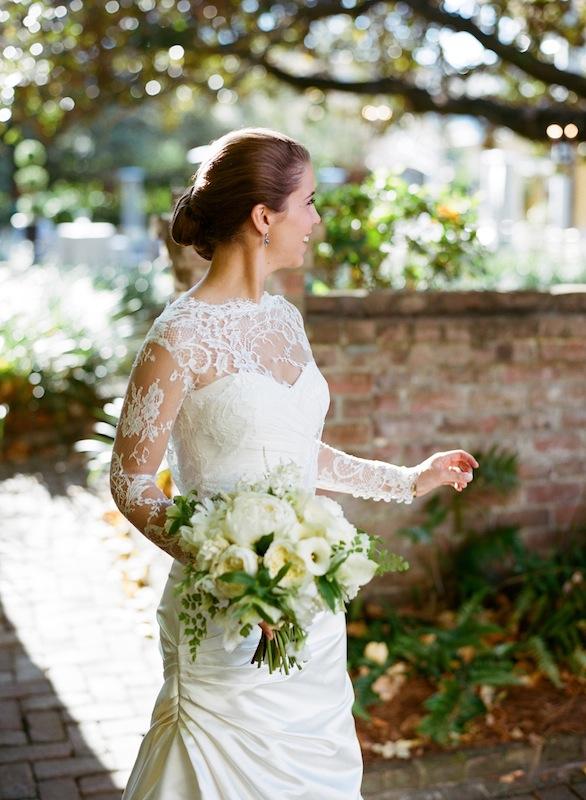 Bridal attire by Monique Lhuillier, available in Charleston through Maddison Row. Hair by Stuart Lawrence Salon. Bouquet by Sara York Grimshaw Designs. Image by Marni Rothschild Pictures.