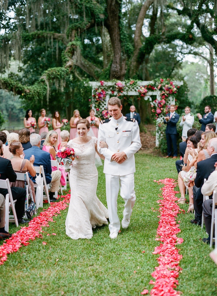 Bride&#039;s gown by Augusta Jones from Gown Boutique of Charleston. Florals by Engaging Events. Photograph by Marni Rothschild Pictures at the Legare Waring House.