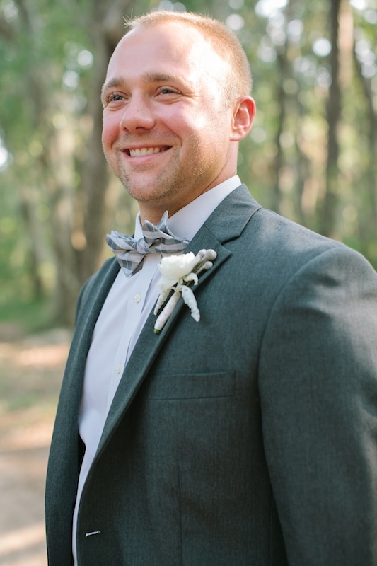 Groom’s attire by Jos. A. Bank. Groom’s bow tie by Banana Republic. Boutonniere by EM Creative Floral. Image by Ashley Seawell Photography.