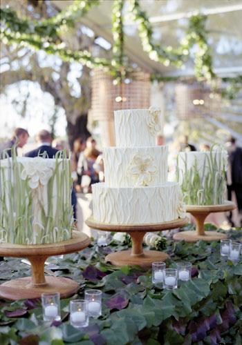 Tall Tiers: Wedding Cakes by Jim Smeal created three blooming confections flavored with chocolate, coconut, orange, and Triple Sec and iced in buttercream.