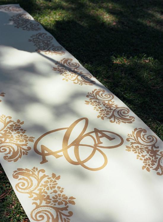 ROAD OF GOLD: The couple’s monogrammed aisle runner was designed by Tara Guérard Soirée and crafted by Anne Melvin with Boutique Tents.