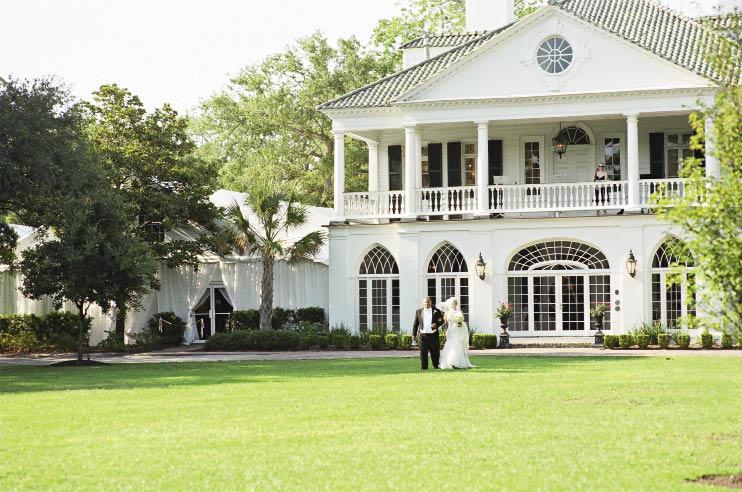 EN PLEIN AIR: The couple chose Lowndes Grove Plantation for its “beautiful and magical” old oaks, says Ashley, pictured here with her father as they approached the ceremony.
