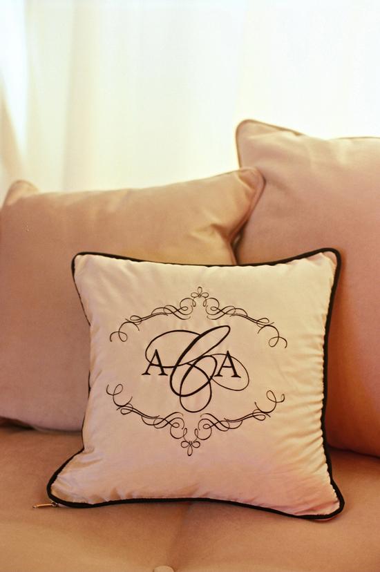COMFY NAMESAKE: Pillows in the lounge area were marked the couple monogram, which was custom-designed by the Lettered Olive.
