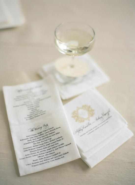 DUAL FOLD: Rather than distributing ceremony programs, the couple had the information printed on cocktail napkins for a money-saving touch. Guests were  given the napkins, along with a glass of champagne, upon arrival to the venue.