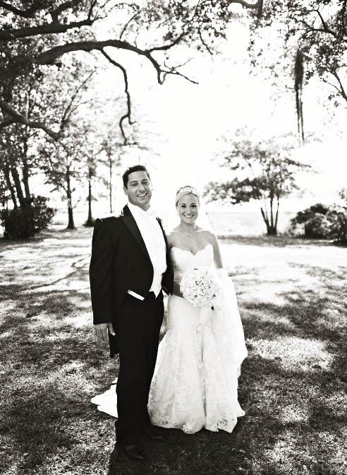 BLACK &amp; WHITE: Ashley wore a Legends by Romona Keveza gown from Maddison Row while Tony suited up in black tails and a white bow tie from Grady Ervin &amp; Co.