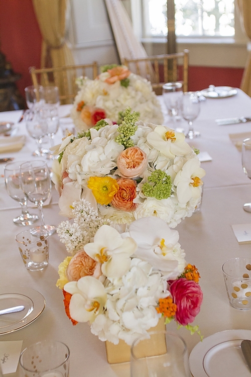 MIX &amp; MATCH: Anne Dabney of stems dotted colorful blooms throughout larger white flowers like hydrangeas and orchids to keep from clashing with the coral walls.