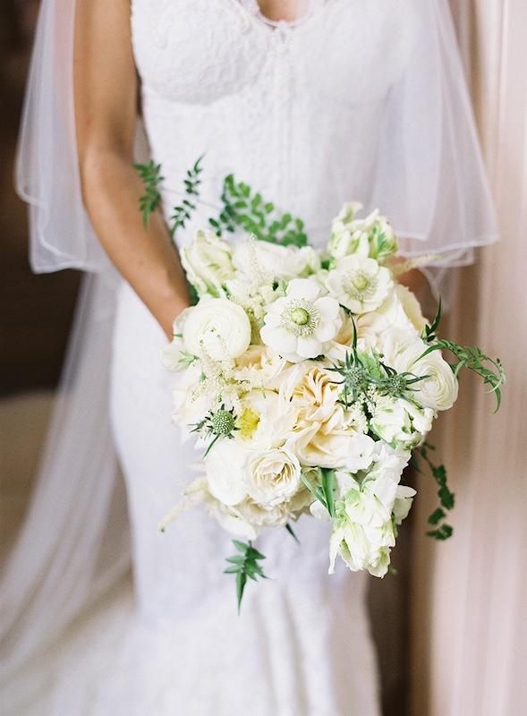 Bouquet by Sara York Grimshaw Designs. Bridal gown by Inbal Dror. Image by Virgil Bunao Photography at Lowndes Grove Plantation.