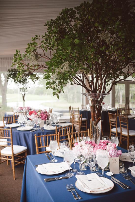 BRING THE OUTDOORS IN: Make a major statement with branches, like these draped with Spanish moss.