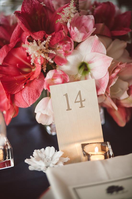 ALL ACCOUNTED FOR The table numbers were pressed into pieces of wood that were supported by white porcelain flowers.