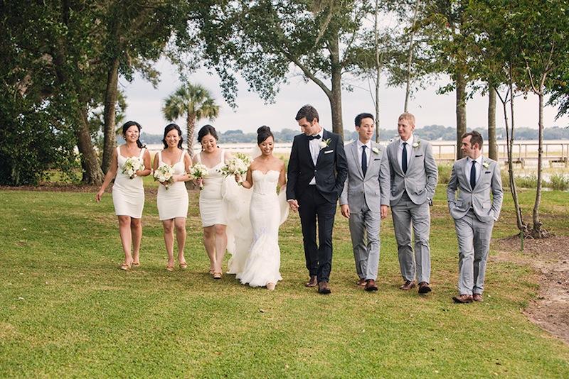 Bridal gown by Inbal Dror. Bridesmaid dresses by BCBGMAXAZRIA. Hair and makeup by Charlotte Belk. Groom’s suit by Burberry. Groomsmen’s suits and ties by J.Crew. Florals by Sara York Grimshaw Designs. Image by Virgil Bunao Photography at Lowndes Grove Plantation.