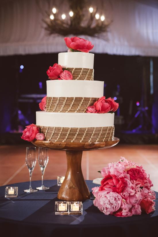SOUTHERN TREAT: The three-tiered wedding cake by Wedding Cakes by Jim Smeal featured sweetgrass detailing as a nod to the flower girls’ baskets.
