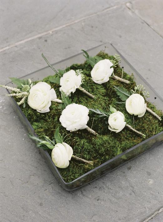 Sara York Grimshaw Designs crafted boutonnieres from ranunculus, astilbe, and fresh greens.