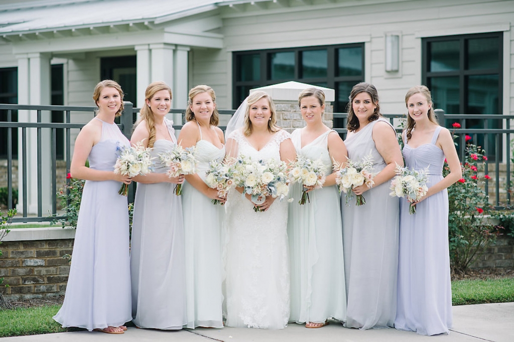 Bride&#039;s gown by Maggie Sottero, available in Charleston through Bridals by Jodi. Bridesmaid gowns by Amsale from Bella Bridesmaids. Image by Aaron and Jillian Photography at Wild Dunes Resort.