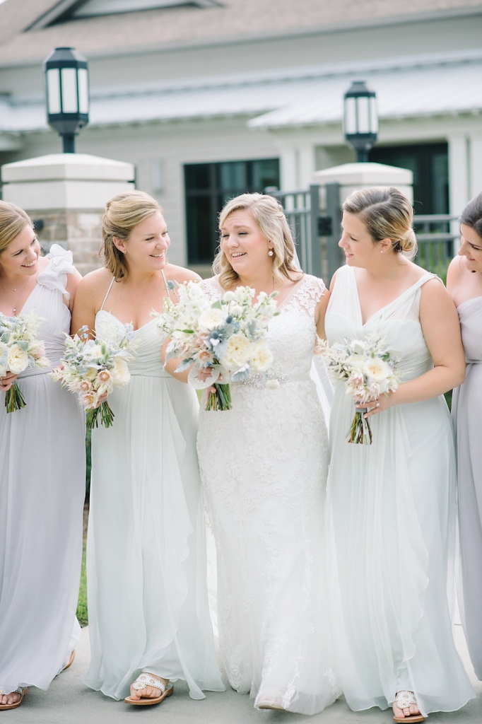 Bride&#039;s gown by Maggie Sottero, available in Charleston through Bridals by Jodi. Bridesmaid gowns by Amsale from Bella Bridesmaids. Florals by Branch Design Studio. Image by Aaron and Jillian Photography at Wild Dunes Resort.