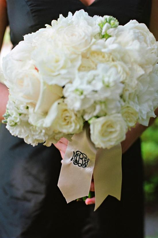 TRADITIONAL TONES: All-white bridesmaid bouquets popped against their full-length Jenny Yoo frocks from Bella Bridesmaid.