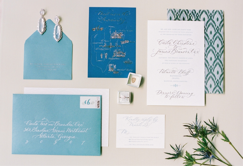 The couple’s stationery suite included letterpress invitations, a custom gilded map, ikat patterns, hand-calligraphed addressing, and (not pictured) a watercolor of the chapel where they exchanged vows.