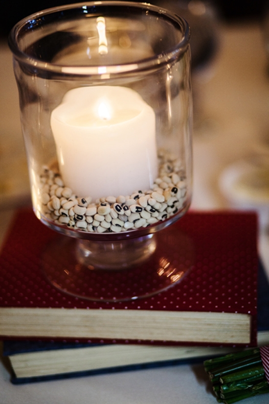 GOOD FORTUNE: A sign of luck in the South, black eyed peas formed the base for candles nestled in hurricane jars. “It was a pleasant surprise to my husband’s family who is originally from Portugal as black eyed peas are also part of their regional cuisine,” says Kate.