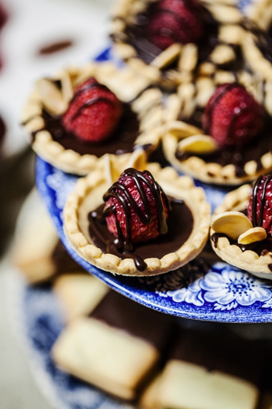 SWEET TREAT: When the bride is a pastry chef, cake just isn’t enough; cue these strawberry and chocolate tartlets.