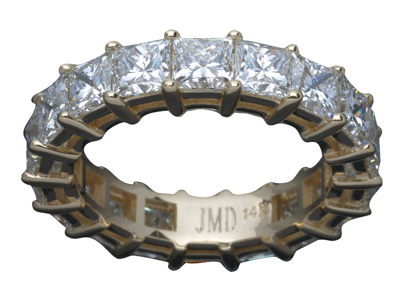 Custom yellow-gold eternity band with 18 princess-cut diamonds totaling 4.69 carats (price upon request) from John Marmo Diamonds
