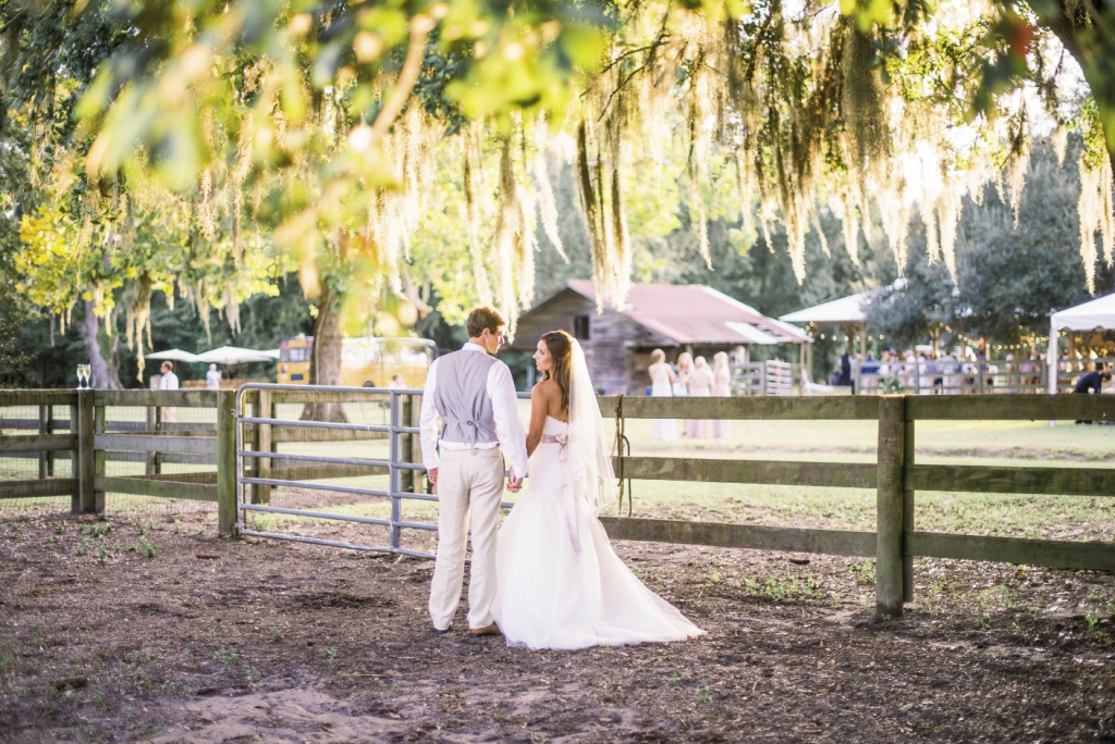 Bride&#039;s gown by Legends by Romona Keveza (available locally through Maddison Row). Groom&#039;s suit by Calvin Klein. Image by Timwill Photography.