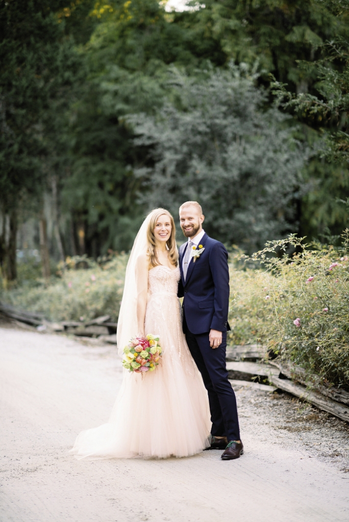 FASHION FORWARD: Lindsay sparkled in a pale pink beaded Monique Lhuillier gown (available in Charleston through Maddison Row), while Brian opted for a  slim-fitting Paul Smith Mainline suit in navy blue, brightened  with a Billy Ball boutonniere.