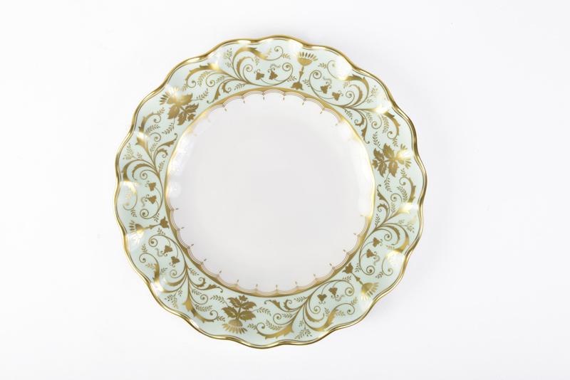 Royal Crown Derbys’ “Darley Abbey” Dessert Plate. Made of fine bone china, the glimmering gold and scalloped detailing on this dinnerware impart English regency style. The Boutique, $285 (8.5-inch plate)