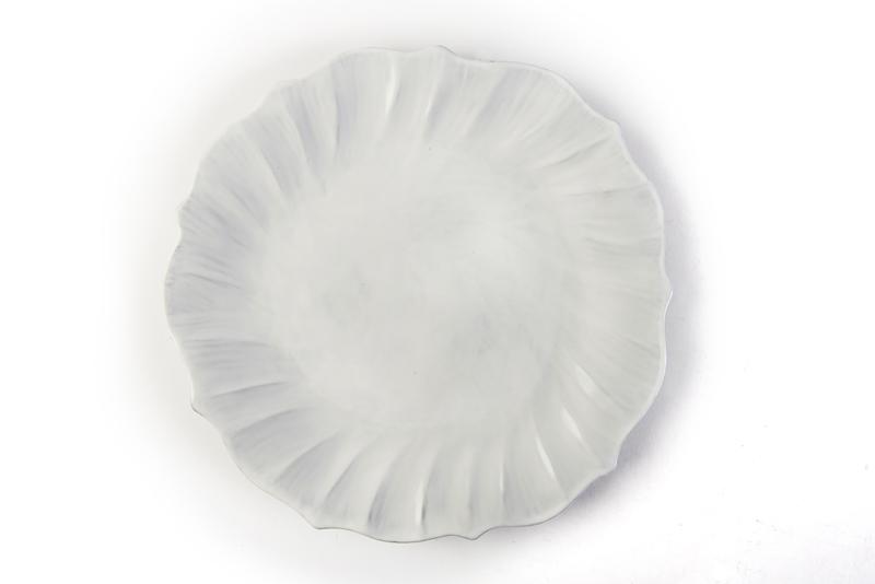 Vietri Incanto Ruffle Dinner Plate. Made of terra marrone, the simplicity of this white dinnerware allows for an easy mix-and-match with other colors and styles. Open House, $46 (12-inch plate)