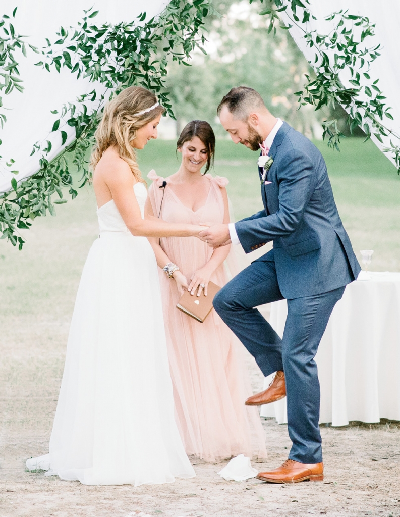 “Our amazing  officiant made the ceremony so personable, unique, and fitting for us,” says Dani. As a nod to her Jewish roots, Andrew sealed their vows by breaking a glass.  &lt;i&gt;Image Aaron &amp; Jillian Photography&lt;/i&gt;