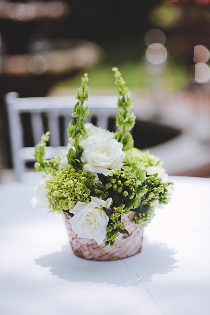 UNDERSTATED STYLE: Loluma tucked the fresh florals into small rustic pots.