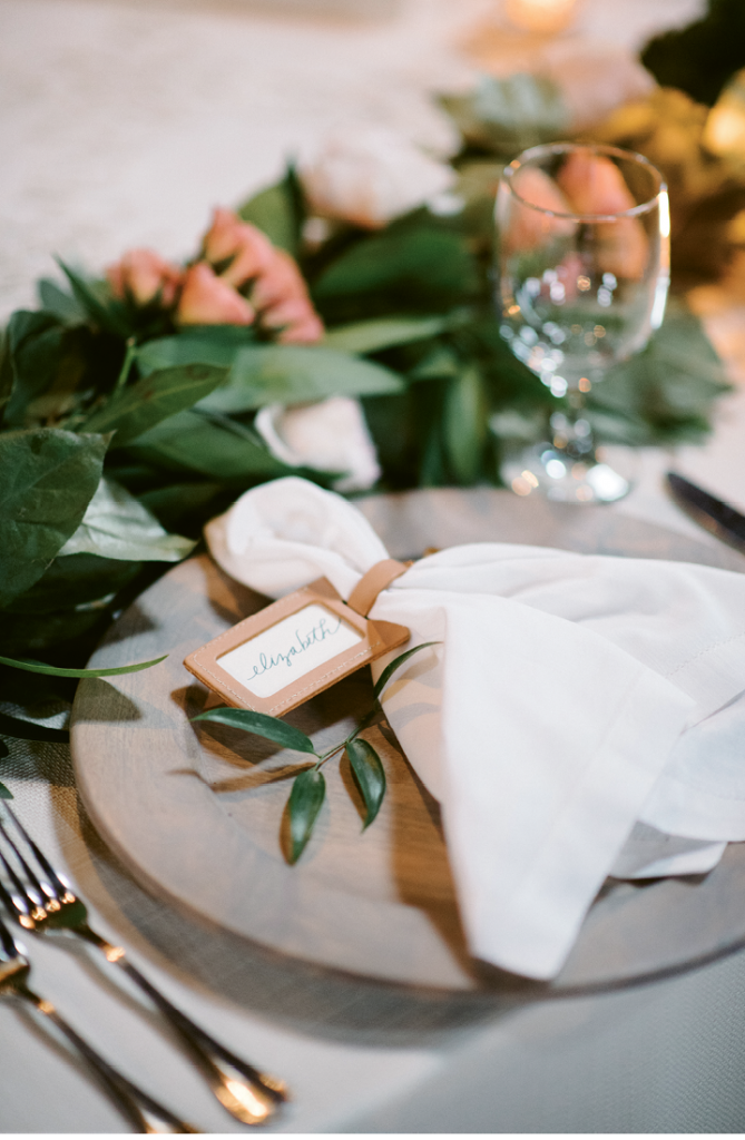 Custom leather luggage tags stamped with “Say ‘I do’ to new adventure” were used for place cards and gifted as favors. (Photograph by Sean Money + Elizabeth Fay)
