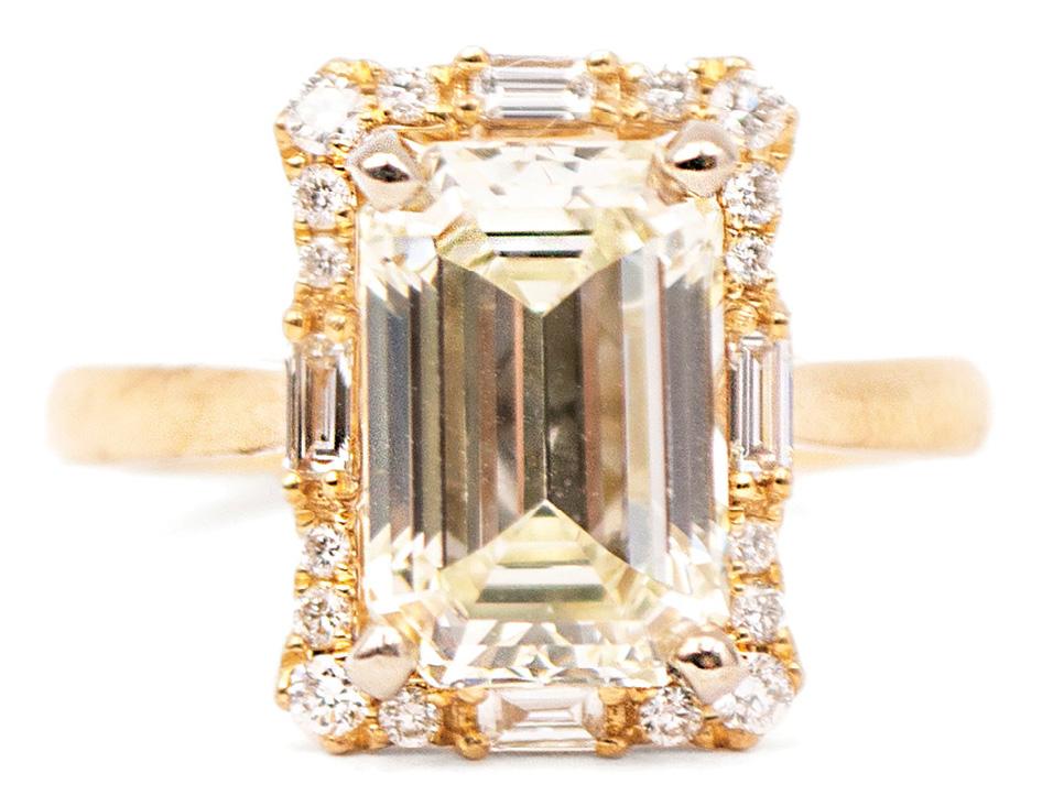 14K yellow gold ring with an emerald-cut diamond (3.32 cts.) surrounded by baguette and round brilliant diamonds (.35 total cts.) from Sandler’s Diamonds &amp; Time ($24,898)