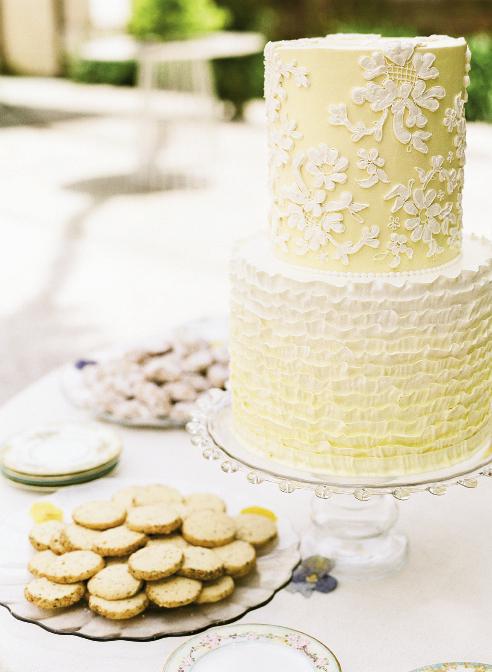 SWEET TREATS: Wedding Cakes by Jim Smeal took inspiration from the lace on Liz’s wedding dress for the cake, which featured lemon and coconut flavors, plus a top tier of chocolate hazelnut for the couple to save for their first anniversary.